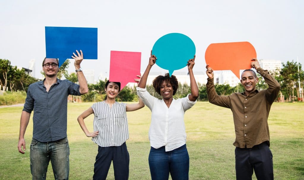 social proof - customers holding speech bubbles