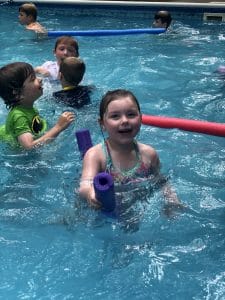 girl swimming in a pool